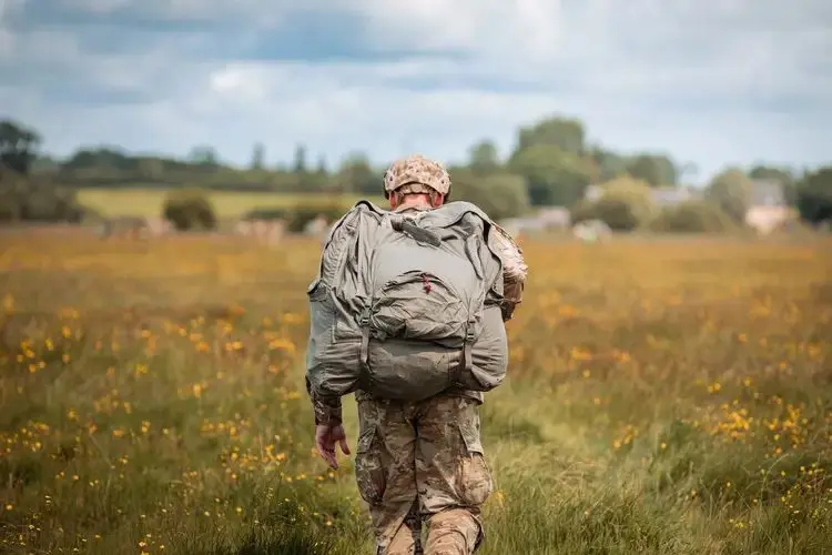 soldier walking in field | va attorney